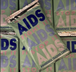 A Grouping of Twenty One [21] Unopened Packs of Early 1990s Aids Educational Trading Cards